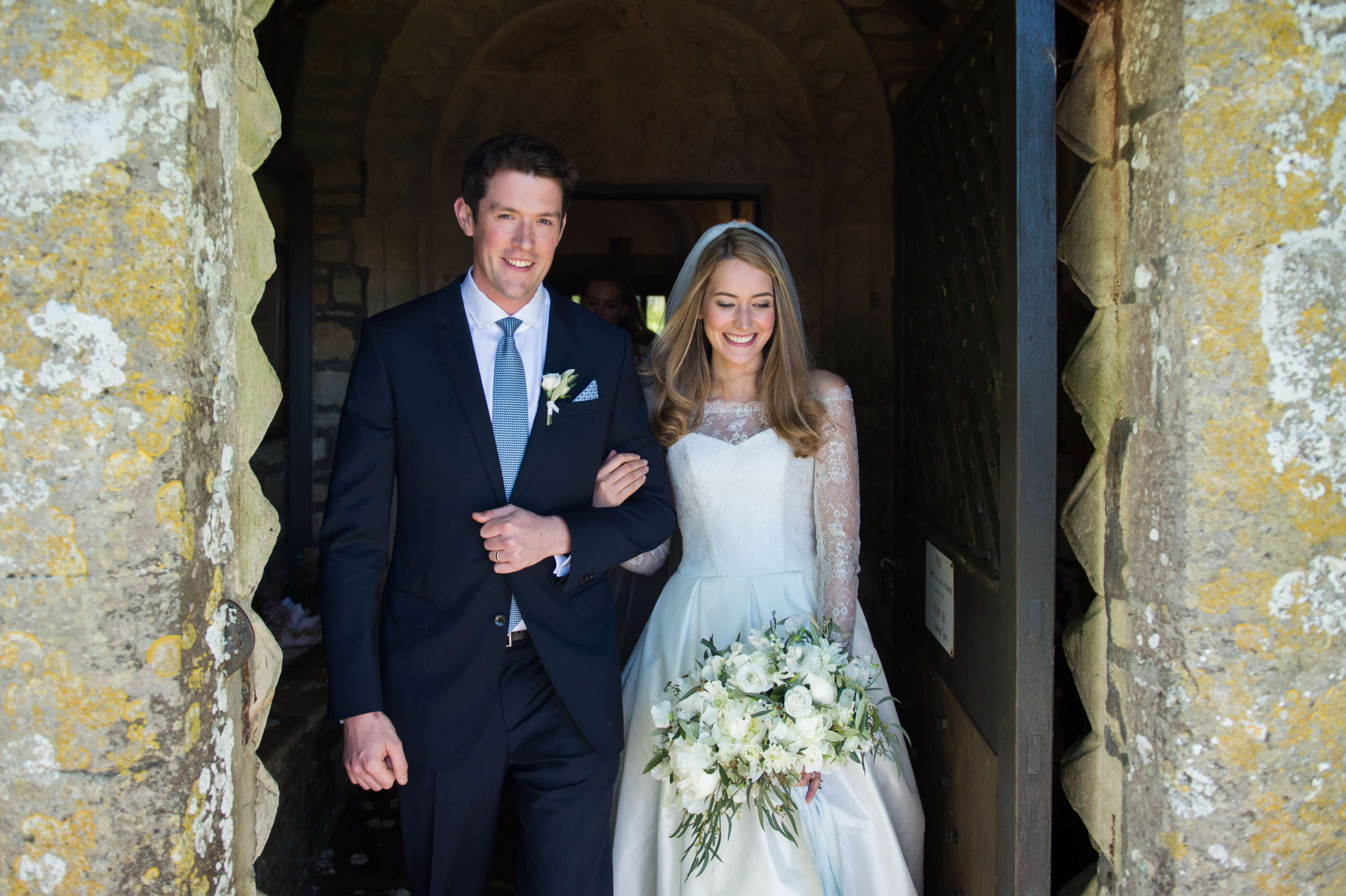bride and groom leaving the church by especially amy wedding photographer